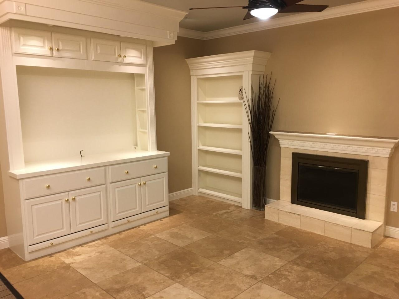 2100 Tanglewilde Street, Unit 537 Houston, TX 77063 - Photo 5 of 13 a view of an empty room with a fireplace and a window