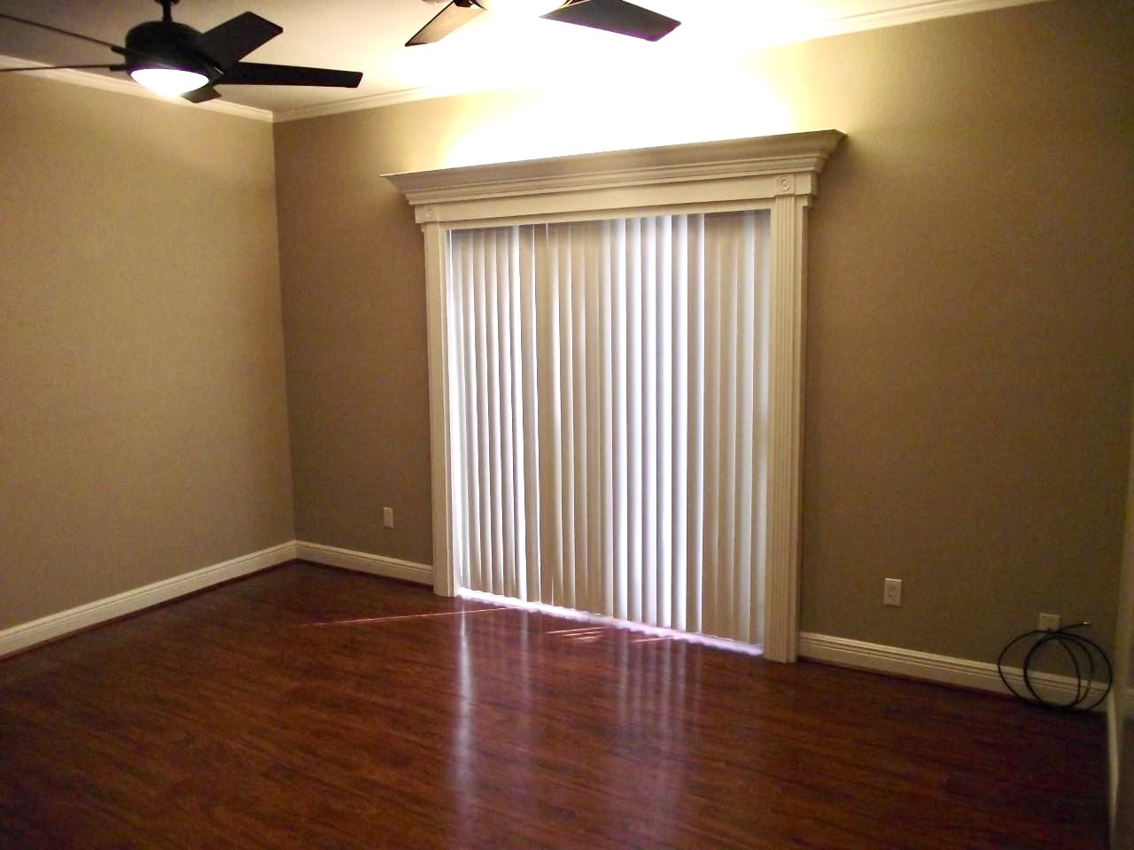2100 Tanglewilde Street, Unit 537 Houston, TX 77063 - Photo 10 of 13 an empty room with wooden floor and windows