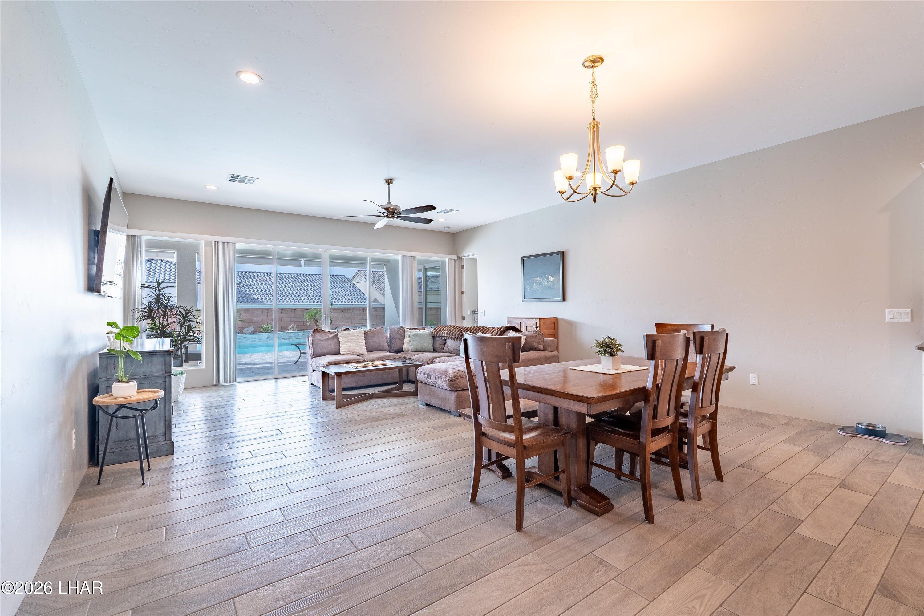 4667 North Juneberry Road Lake Havasu City, AZ 86404 - Photo 14 of 50 a view of a dining room with furniture window and wooden floor