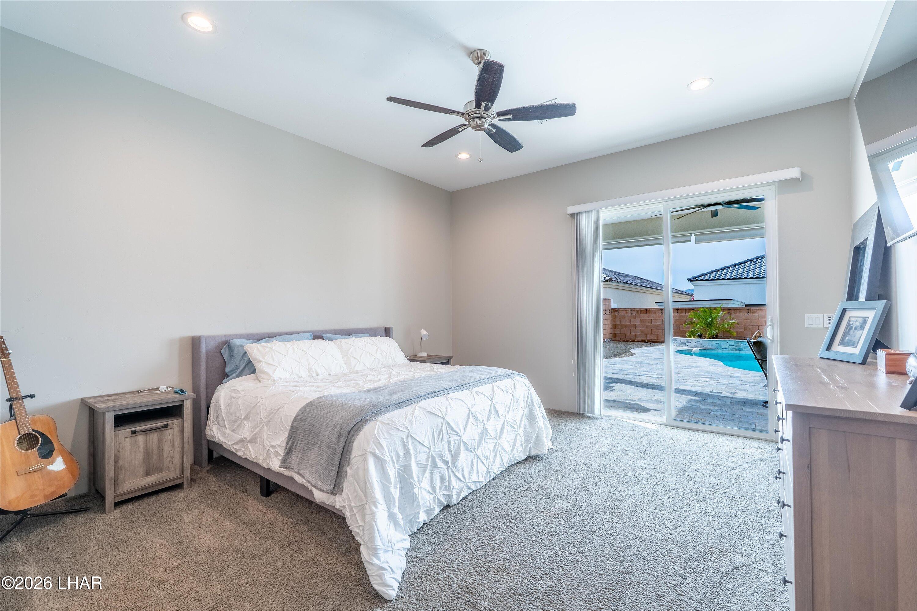 4667 North Juneberry Road Lake Havasu City, AZ 86404 - Photo 17 of 50 a bedroom with a bed and a walk in closet