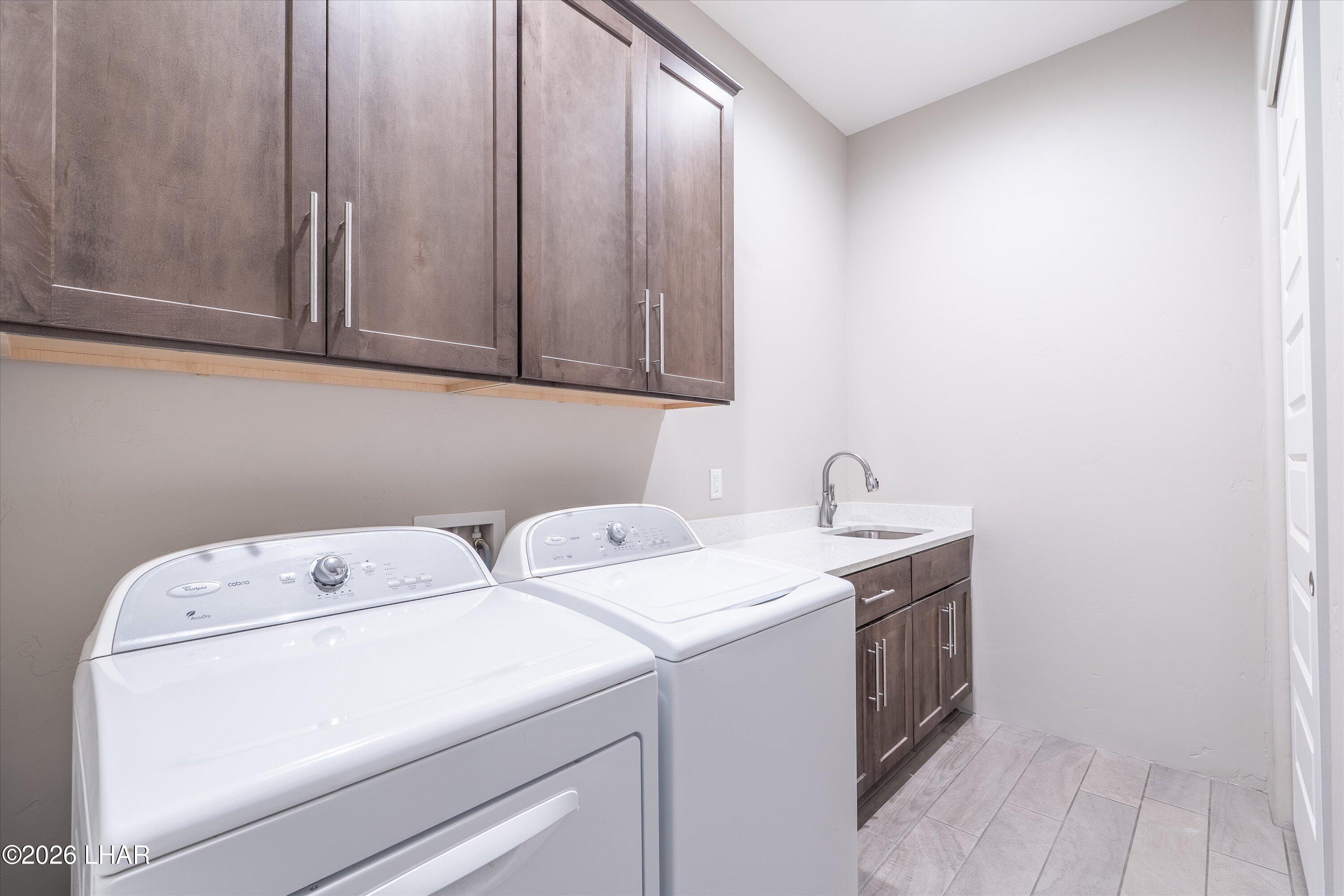 4667 North Juneberry Road Lake Havasu City, AZ 86404 - Photo 18 of 50 a utility room with dryer and washer