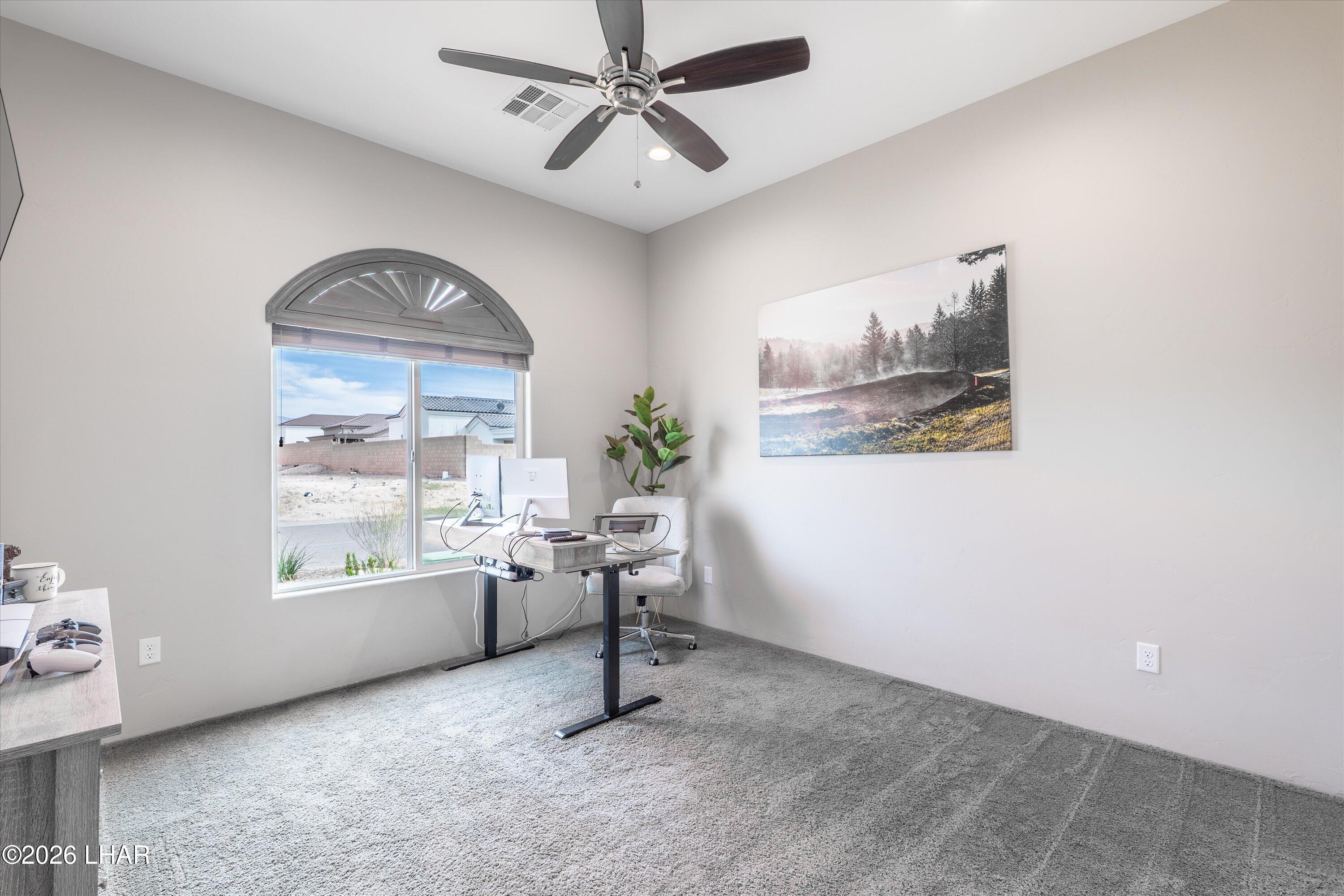 4667 North Juneberry Road Lake Havasu City, AZ 86404 - Photo 20 of 50 a view of workspace with wooden floor and windows