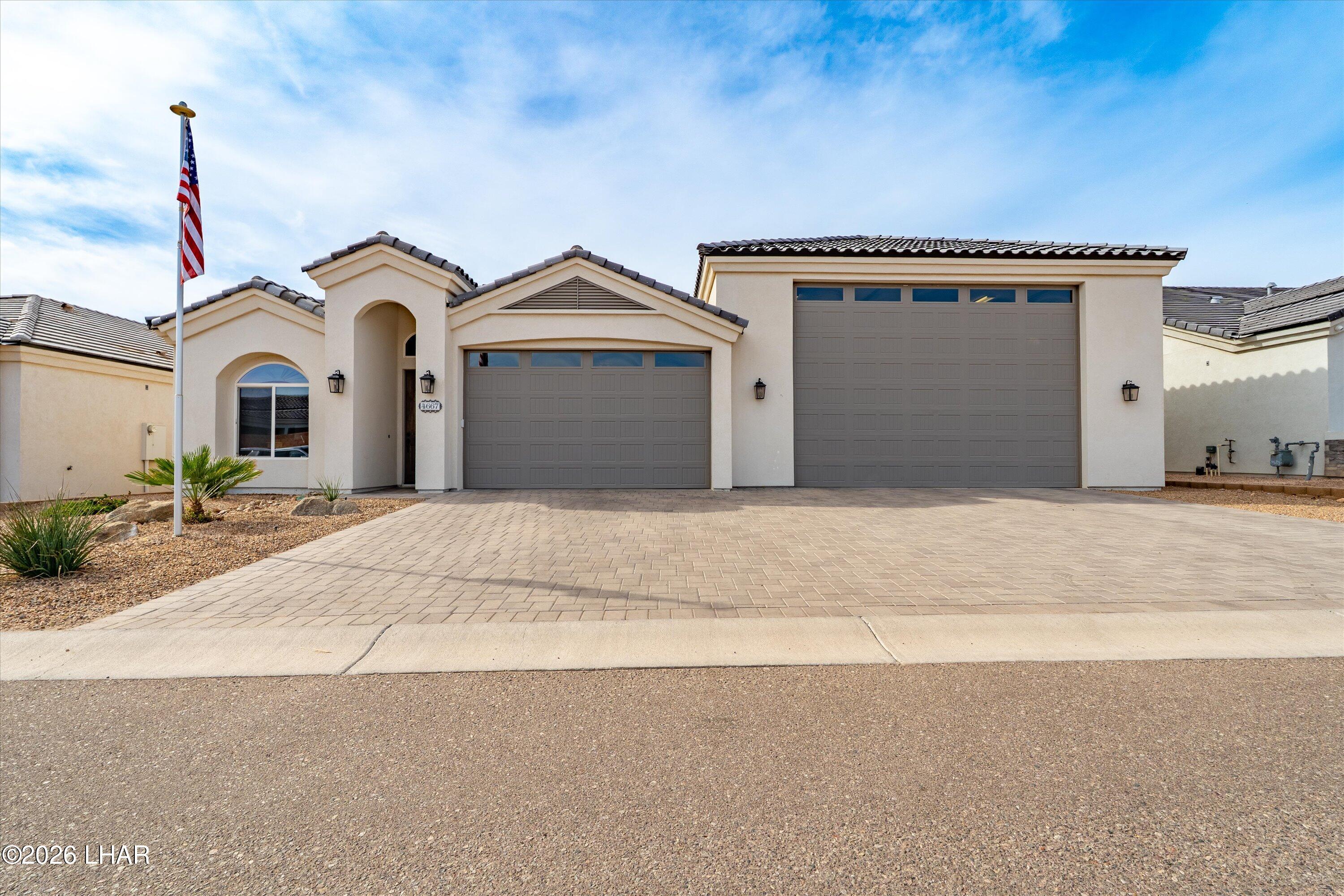 4667 North Juneberry Road Lake Havasu City, AZ 86404 - Photo 2 of 50 a front view of a house with a yard