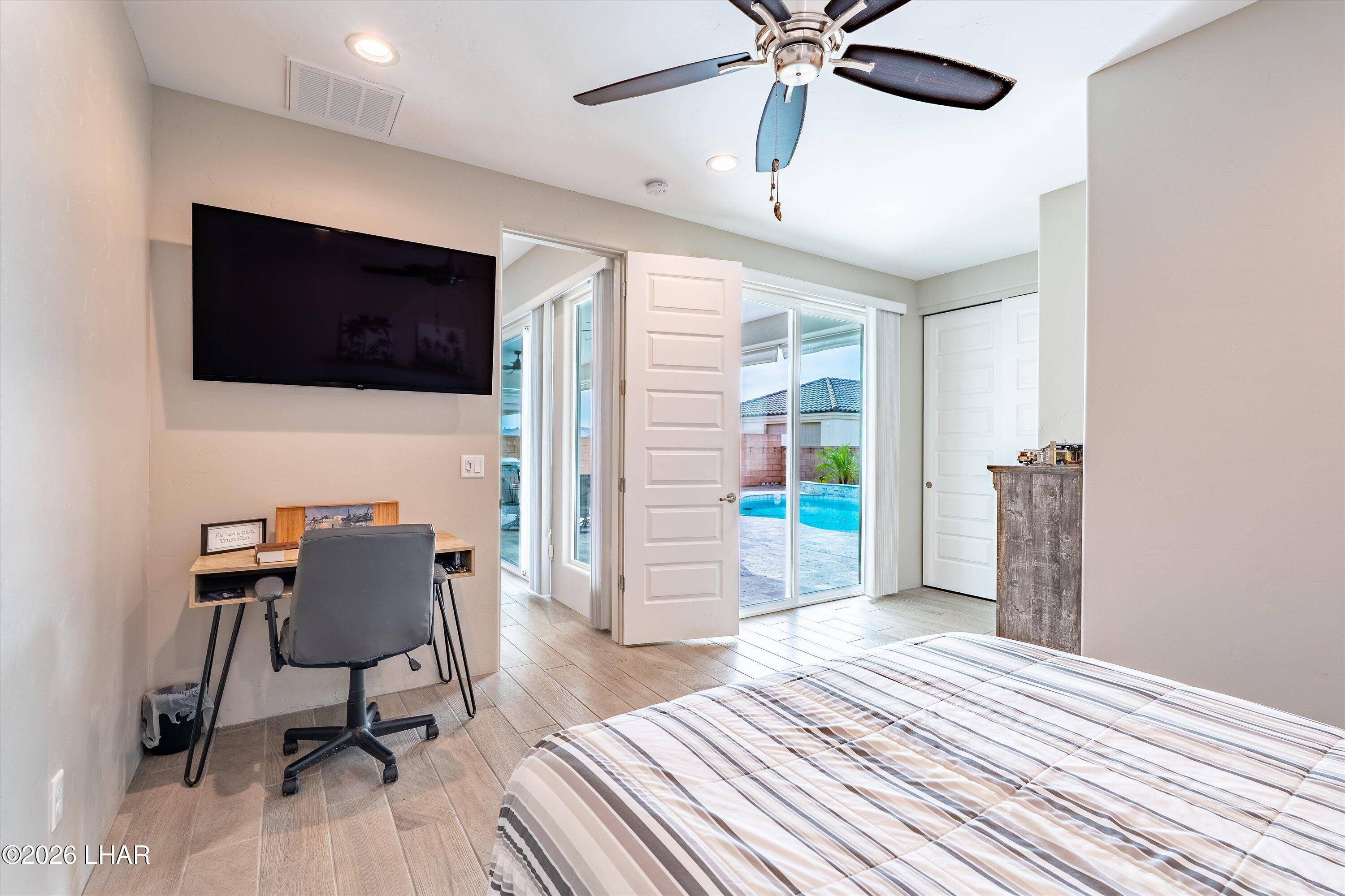 4667 North Juneberry Road Lake Havasu City, AZ 86404 - Photo 22 of 50 a workspace with wooden floor and a bathroom