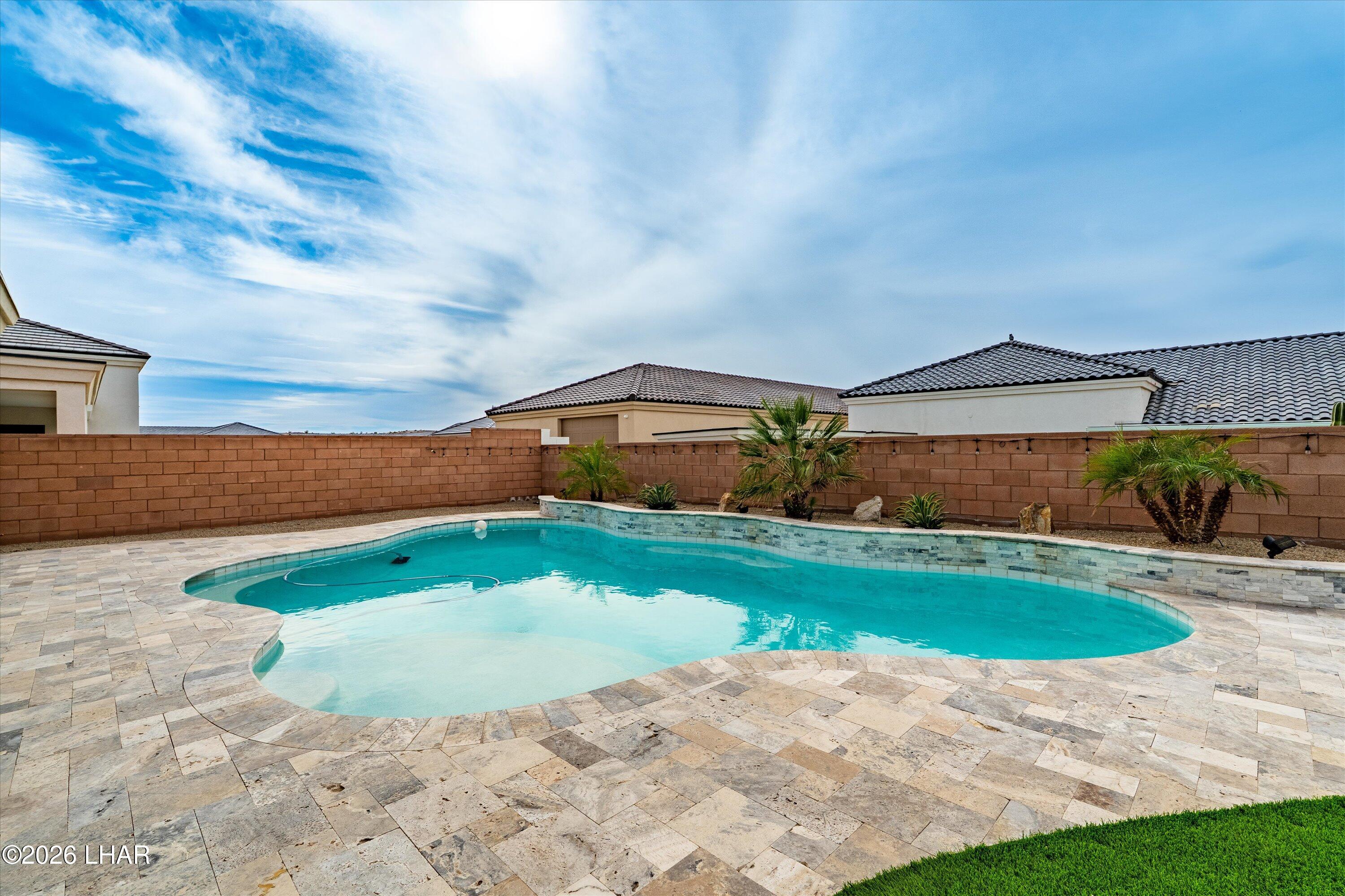 4667 North Juneberry Road Lake Havasu City, AZ 86404 - Photo 29 of 50 a view of outdoor space yard and swimming pool