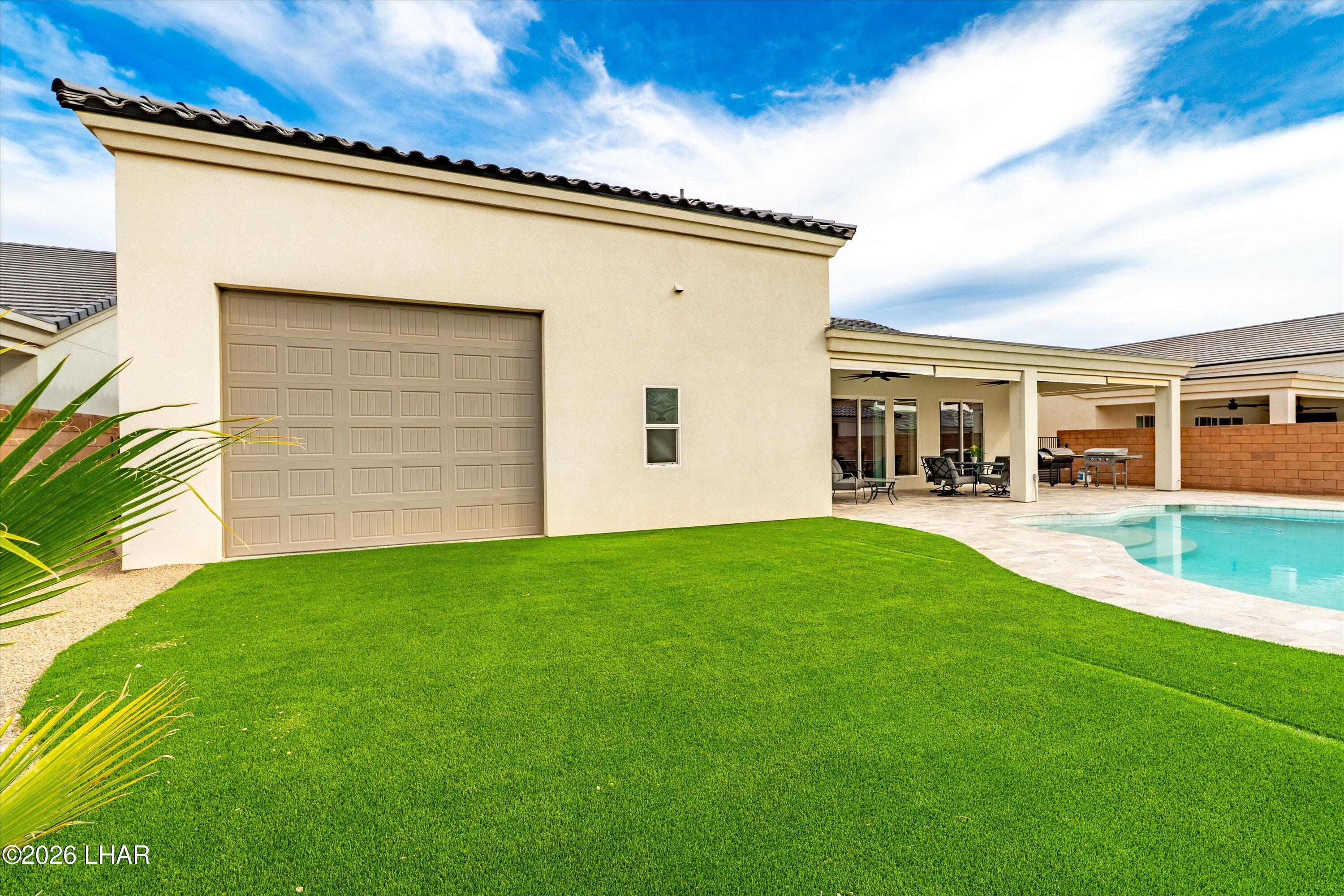 4667 North Juneberry Road Lake Havasu City, AZ 86404 - Photo 31 of 50 front view of house with a yard