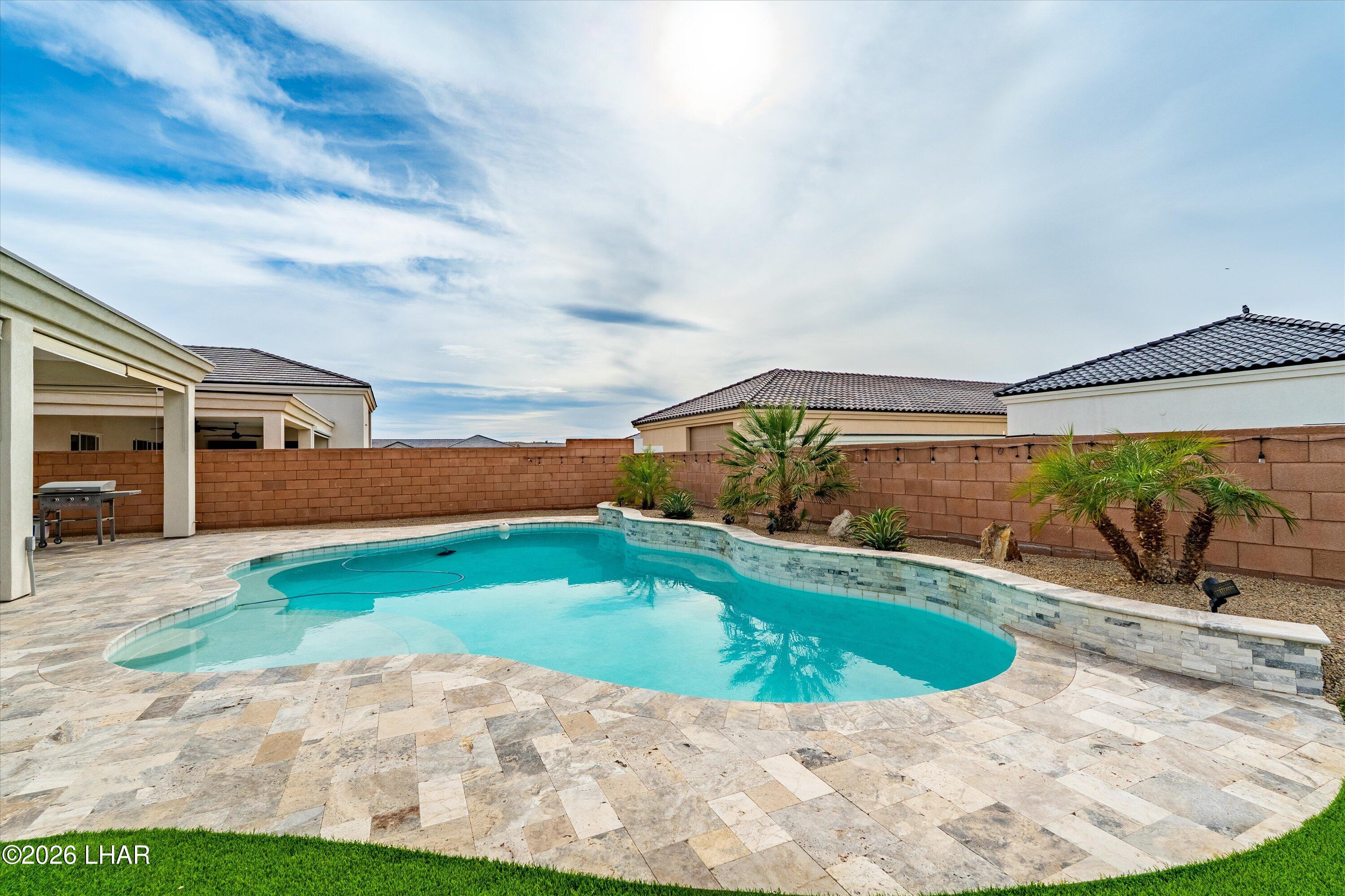 4667 North Juneberry Road Lake Havasu City, AZ 86404 - Photo 32 of 50 a view of a swimming pool with a yard