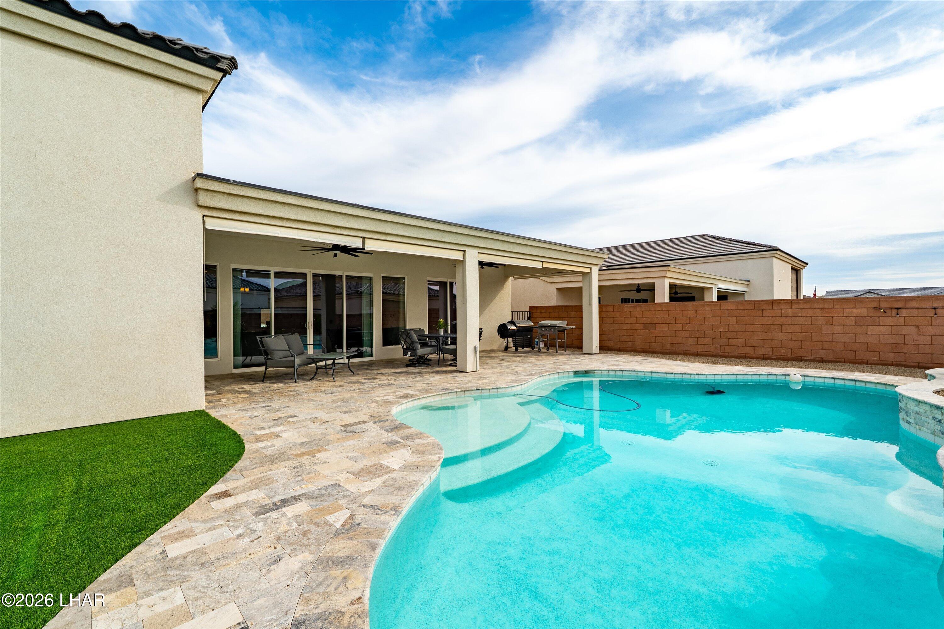 4667 North Juneberry Road Lake Havasu City, AZ 86404 - Photo 33 of 50 a view of house with swimming pool outdoor seating