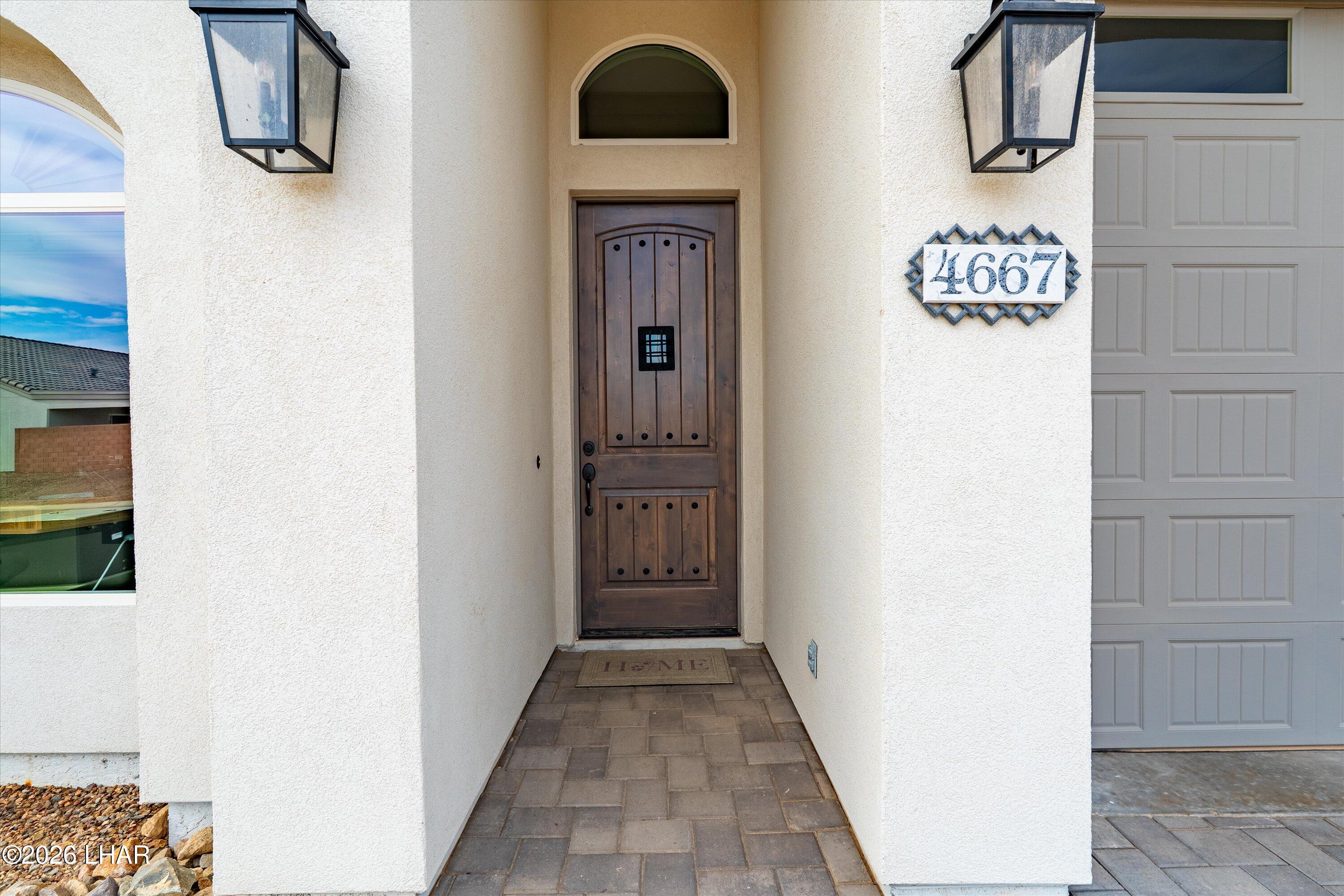 4667 North Juneberry Road Lake Havasu City, AZ 86404 - Photo 4 of 50 a view of a hallway with wooden floor and entryway