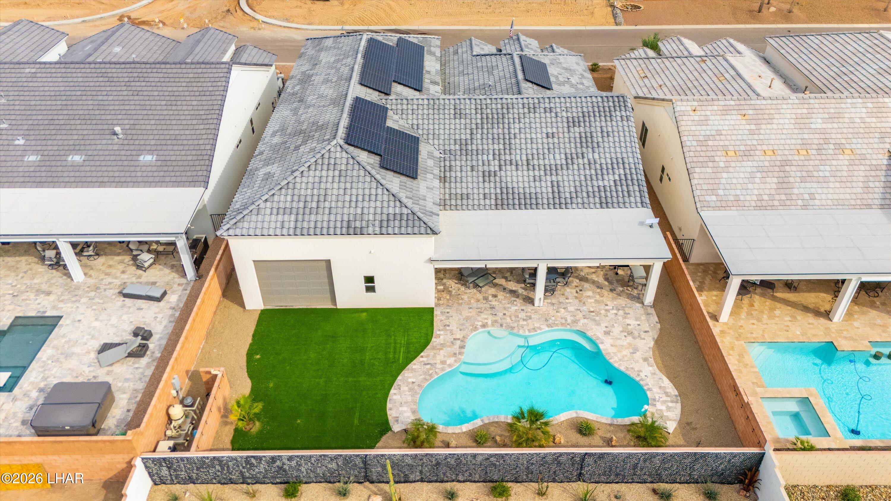 4667 North Juneberry Road Lake Havasu City, AZ 86404 - Photo 42 of 50 front view of a brick house with a small yard