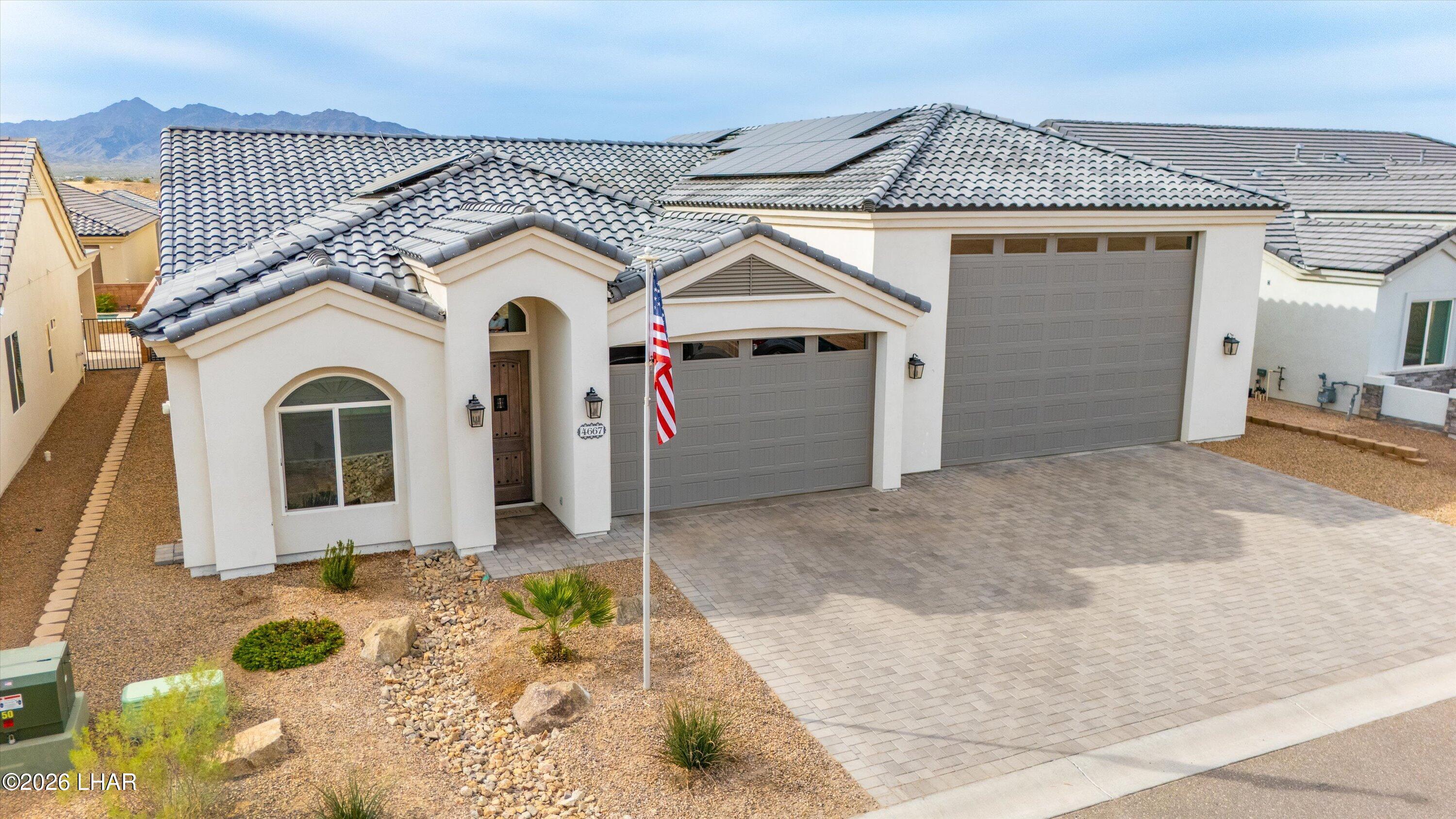 4667 North Juneberry Road Lake Havasu City, AZ 86404 - Photo 44 of 50 a front view of a house with white fence