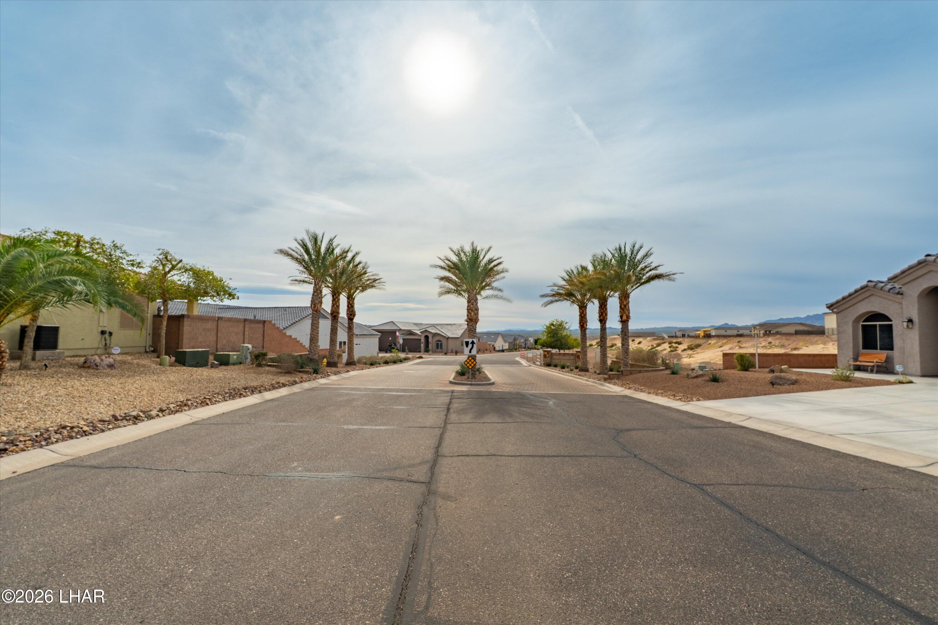 4667 North Juneberry Road Lake Havasu City, AZ 86404 - Photo 49 of 50 a house with a yard and a garage