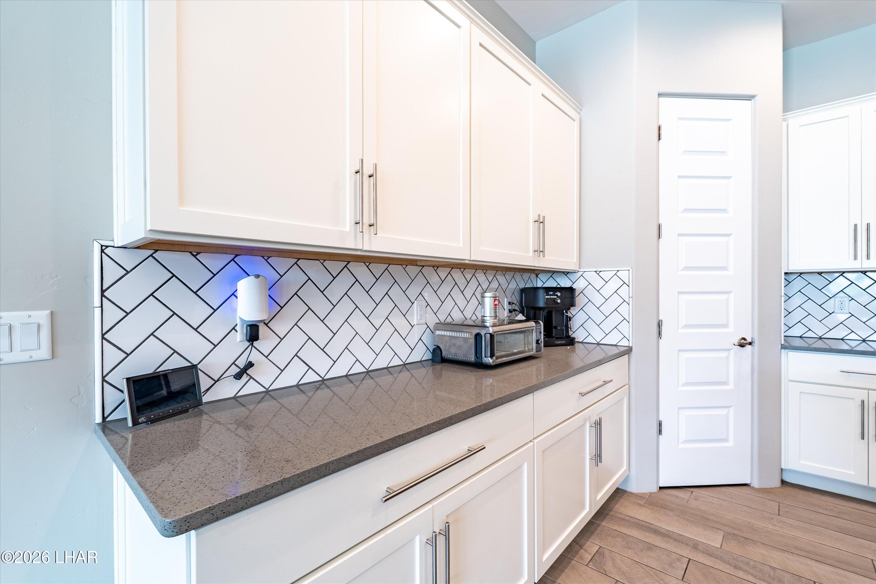 4667 North Juneberry Road Lake Havasu City, AZ 86404 - Photo 7 of 50 a kitchen with a sink and cabinets