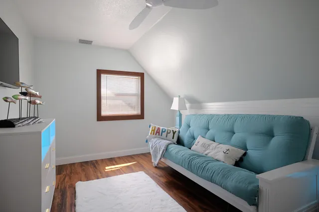 a bathroom with a granite countertop shower sink and mirror