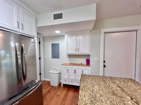 a bedroom with a bed and a flat tv screen