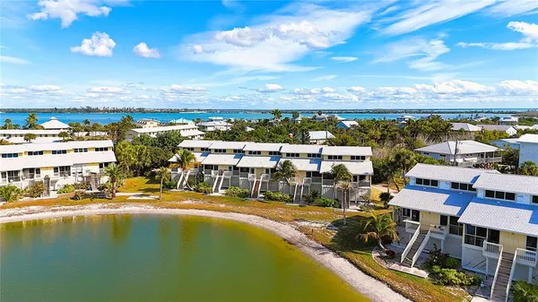 a aerial view of a house with table and chairs