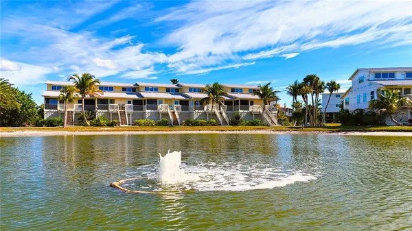a view of kitchen and hall with wooden floor