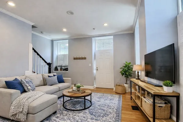 a living room with furniture and a flat screen tv