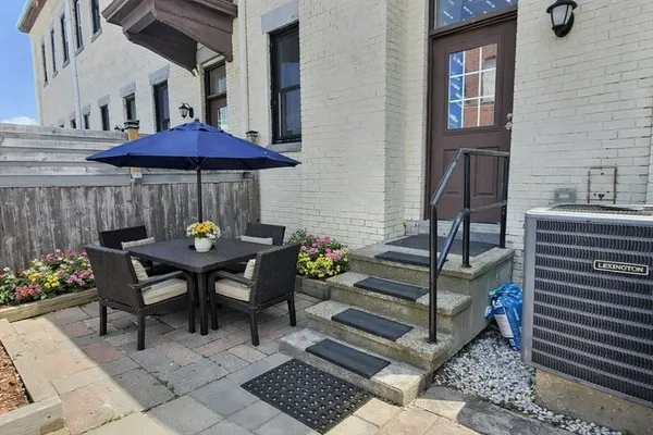 a view of a table and chairs in patio