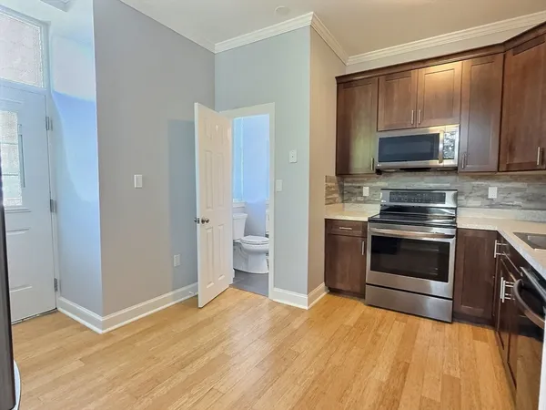 a kitchen with a stove and a microwave