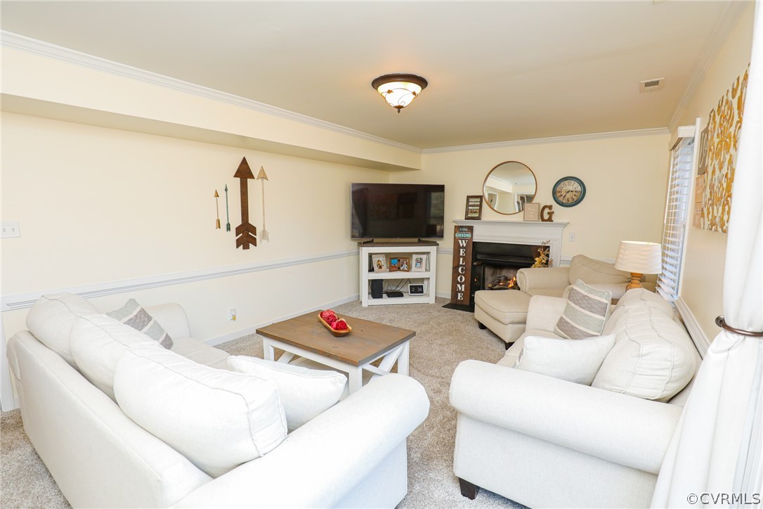 14025 Sagebrook Road Midlothian, VA 23112 - Photo 12 of 49 a living room with furniture and a flat screen tv