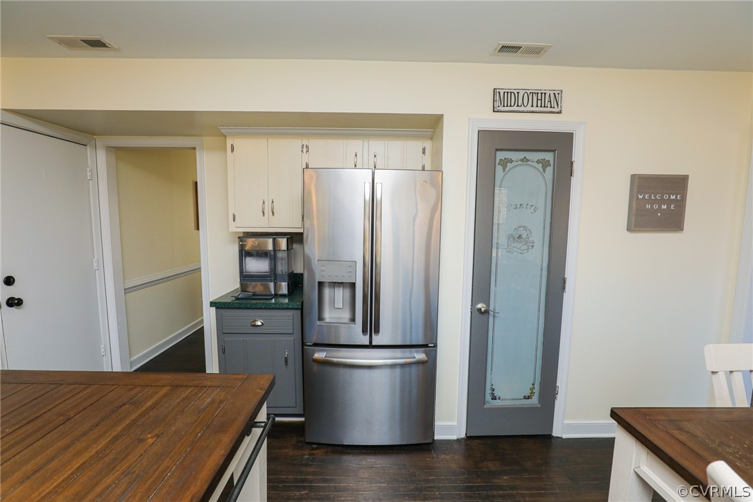 14025 Sagebrook Road Midlothian, VA 23112 - Photo 19 of 49 a view of a kitchen with a table and a refrigerator