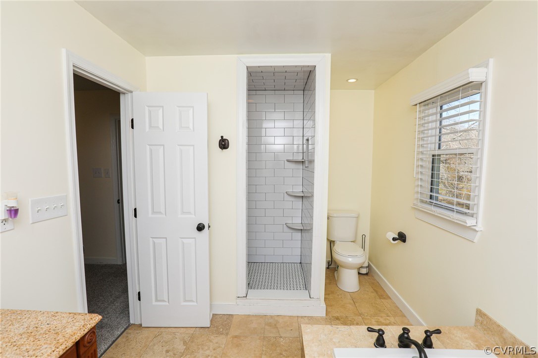 14025 Sagebrook Road Midlothian, VA 23112 - Photo 27 of 49 a bathroom with a tub shower and sink
