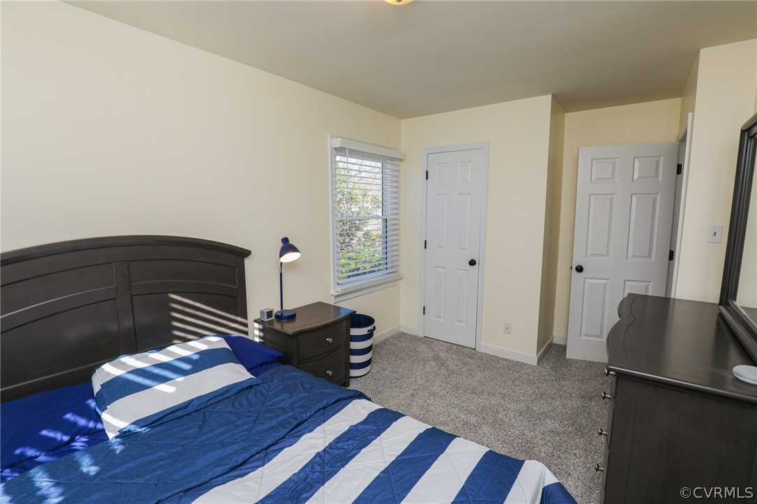14025 Sagebrook Road Midlothian, VA 23112 - Photo 32 of 49 a bedroom with a bed and wooden floor