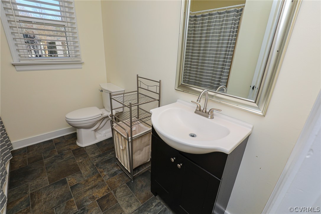 14025 Sagebrook Road Midlothian, VA 23112 - Photo 36 of 49 a bathroom with a sink a toilet and mirror