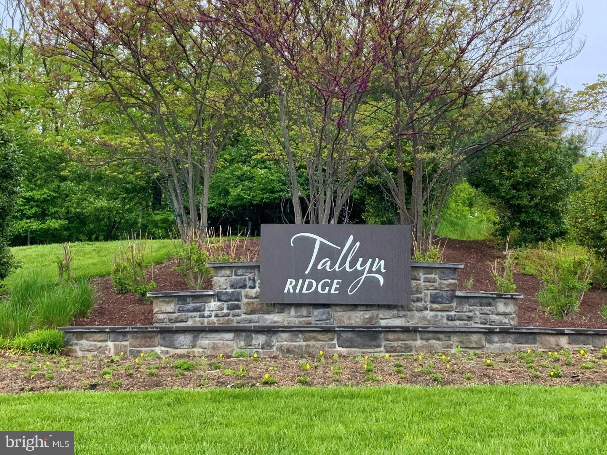 5763 Hawk Ridge Road Frederick, MD 21704 - Photo 2 of 73 a front view of a house with a garden