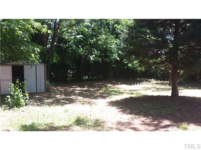 5117 Kaplan Drive Raleigh, NC 27606 - Photo 3 of 4 a view of a backyard