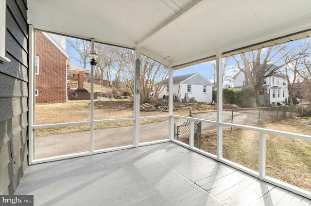 a view of open space with garden and trees