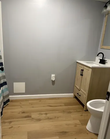 a bathroom with a bathtub and shower