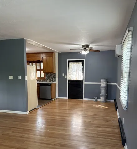 a view of kitchen with sink and wooden floor