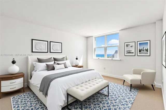 a living room with furniture and floor to ceiling windows