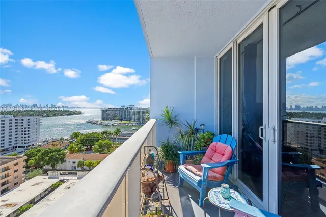 a view of a balcony with chairs