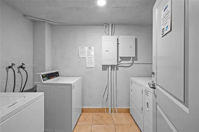 a view of a room with washer and dryer