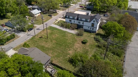 an aerial view of residential house with outdoor space