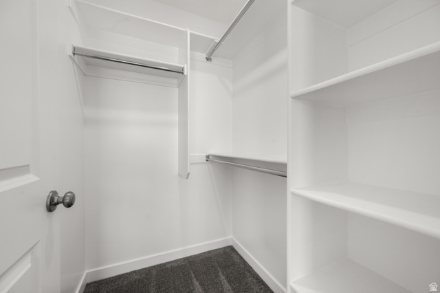 1554 Pheasant Road Eagle Mountain, UT 84005 - Photo 19 of 29 Walk in closet featuring dark carpet