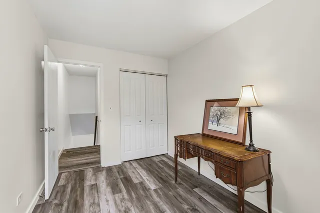 a view of room with furniture and wooden floor