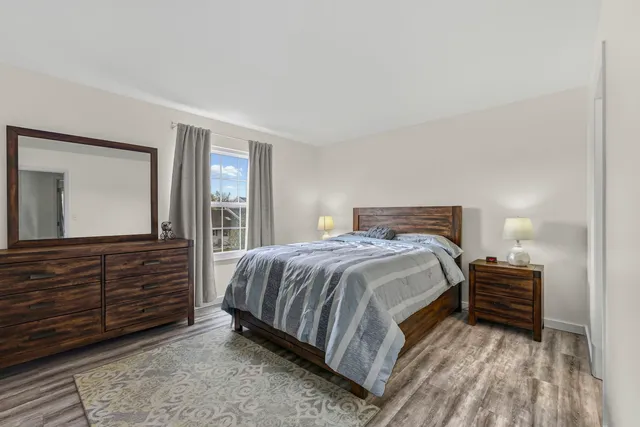 a bedroom with a bed and a dresser