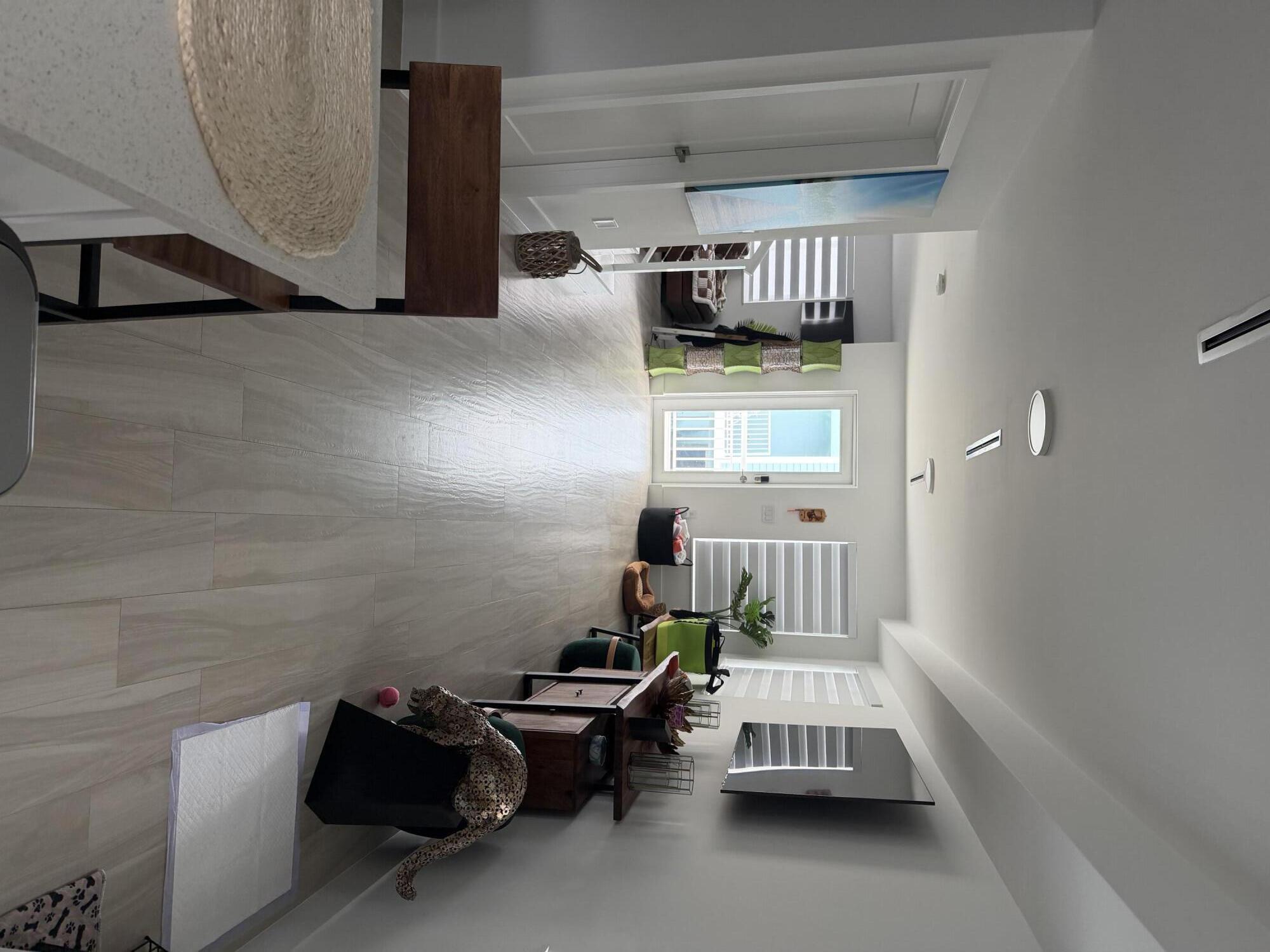 94825 Overseas Highway, Unit 8 Key Largo, FL 33037 - Photo 2 of 12 a bedroom with bed and window