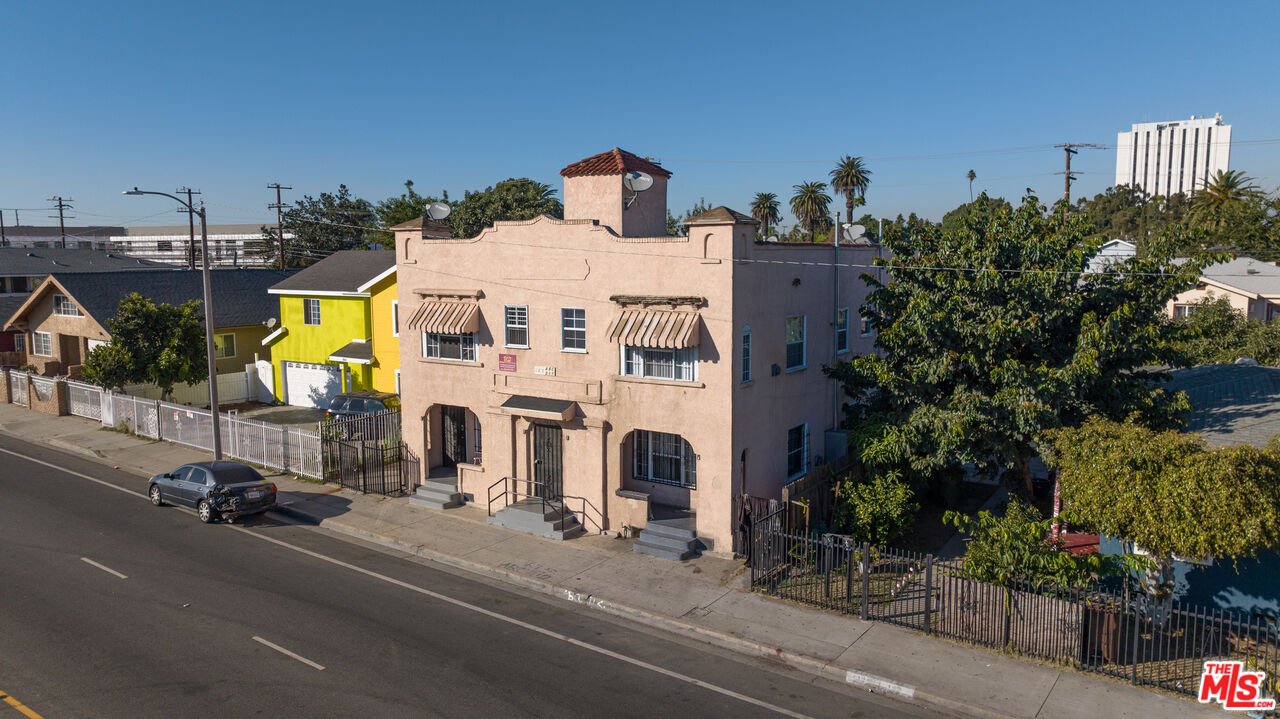 a view of multiple houses with a street