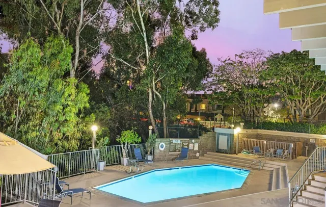 a view of a backyard with sitting area