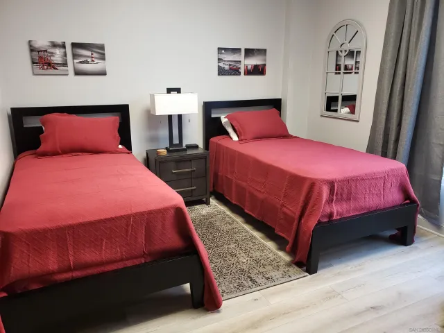 a living room with patio furniture and garden view