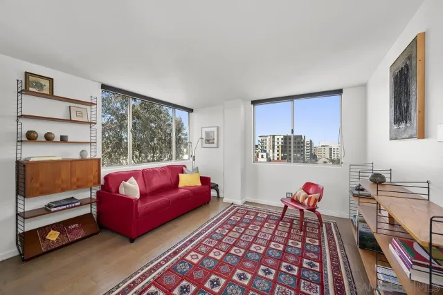 a bedroom with furniture and a flat screen tv