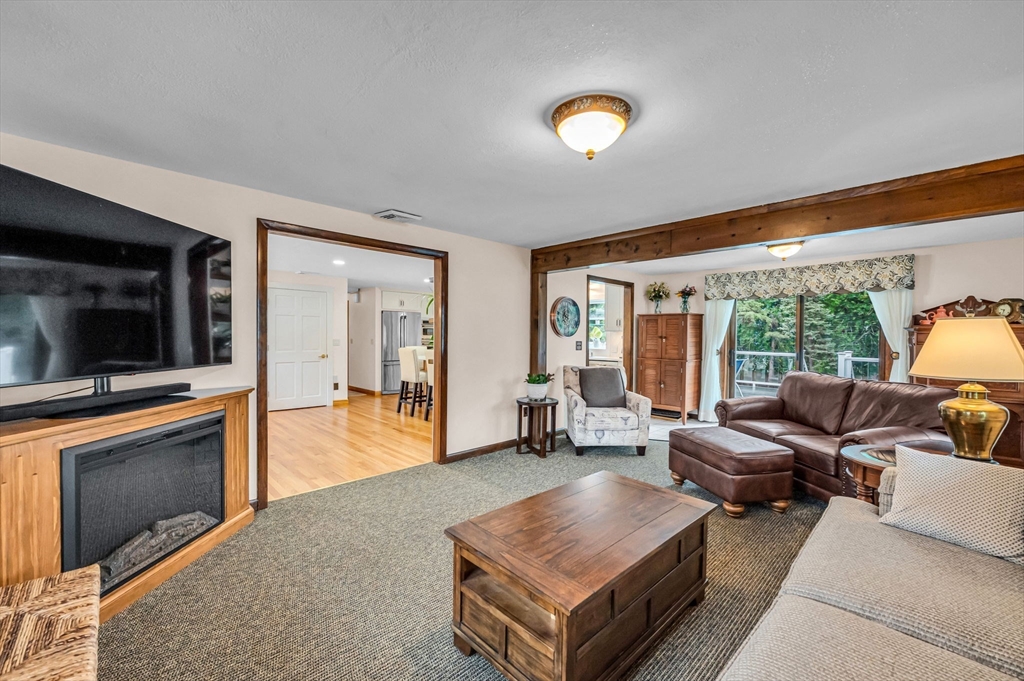 83 Loomis Drive Chicopee, MA 01020 - Photo 12 of 40 a living room with furniture and a flat screen tv