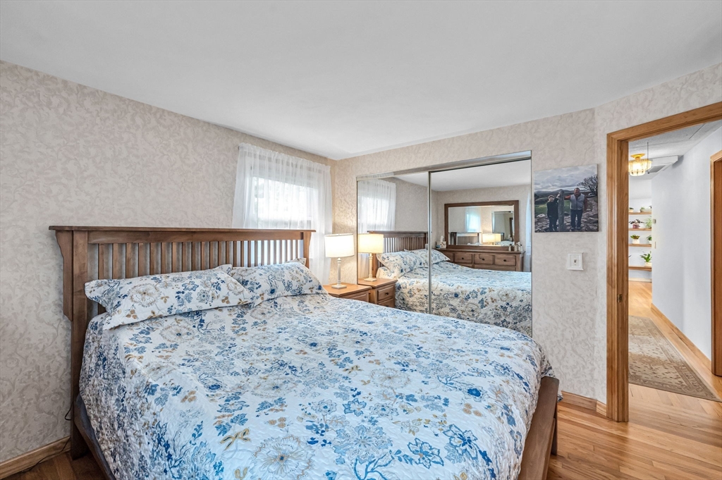 83 Loomis Drive Chicopee, MA 01020 - Photo 13 of 40 a bedroom with a large bed and a dresser