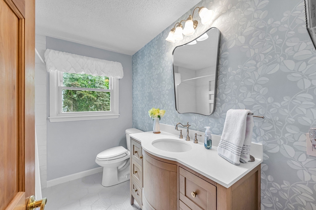83 Loomis Drive Chicopee, MA 01020 - Photo 15 of 40 a bathroom with a sink vanity and a mirror