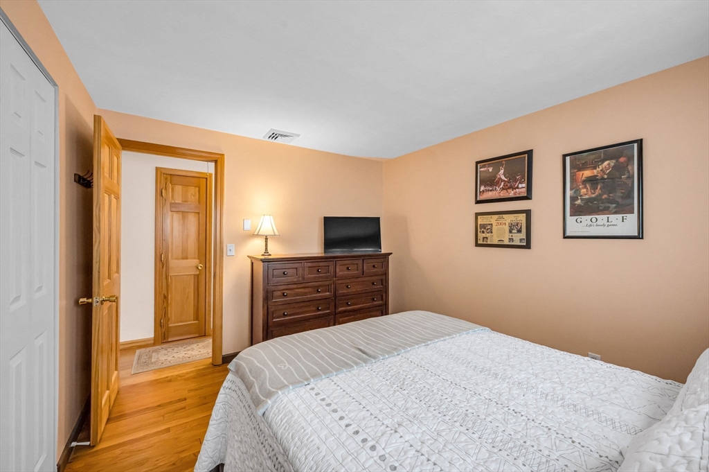 83 Loomis Drive Chicopee, MA 01020 - Photo 17 of 40 a bedroom with a bed and a television